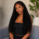 UrbanChichair Virgin Water Wave Bundles Double Drawn model front view wearing long natural black water wave human hair extensions with a soft glossy finish.