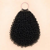 UrbanChichair natural black Ramen Curl human hair crochet extensions displayed on a blush pink ring