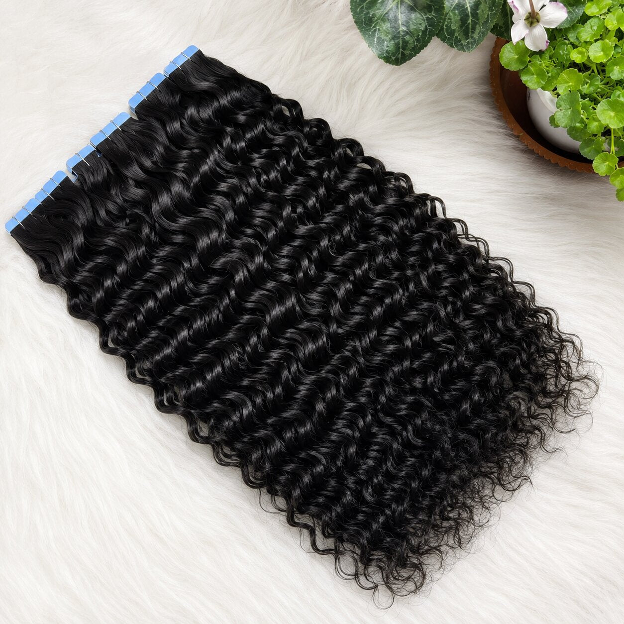 Water Wave Tape In Hair Extensions double drawn human hair flat lay showing glossy black waves and seamless tape tabs