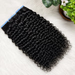 Water Wave Tape In Hair Extensions double drawn human hair flat lay showing glossy black waves and seamless tape tabs