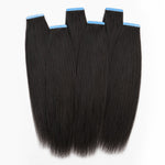 Yaki Straight tape in hair extensions in natural black human hair with blue adhesive tabs, showing soft textured straight hair from UrbanChichair.